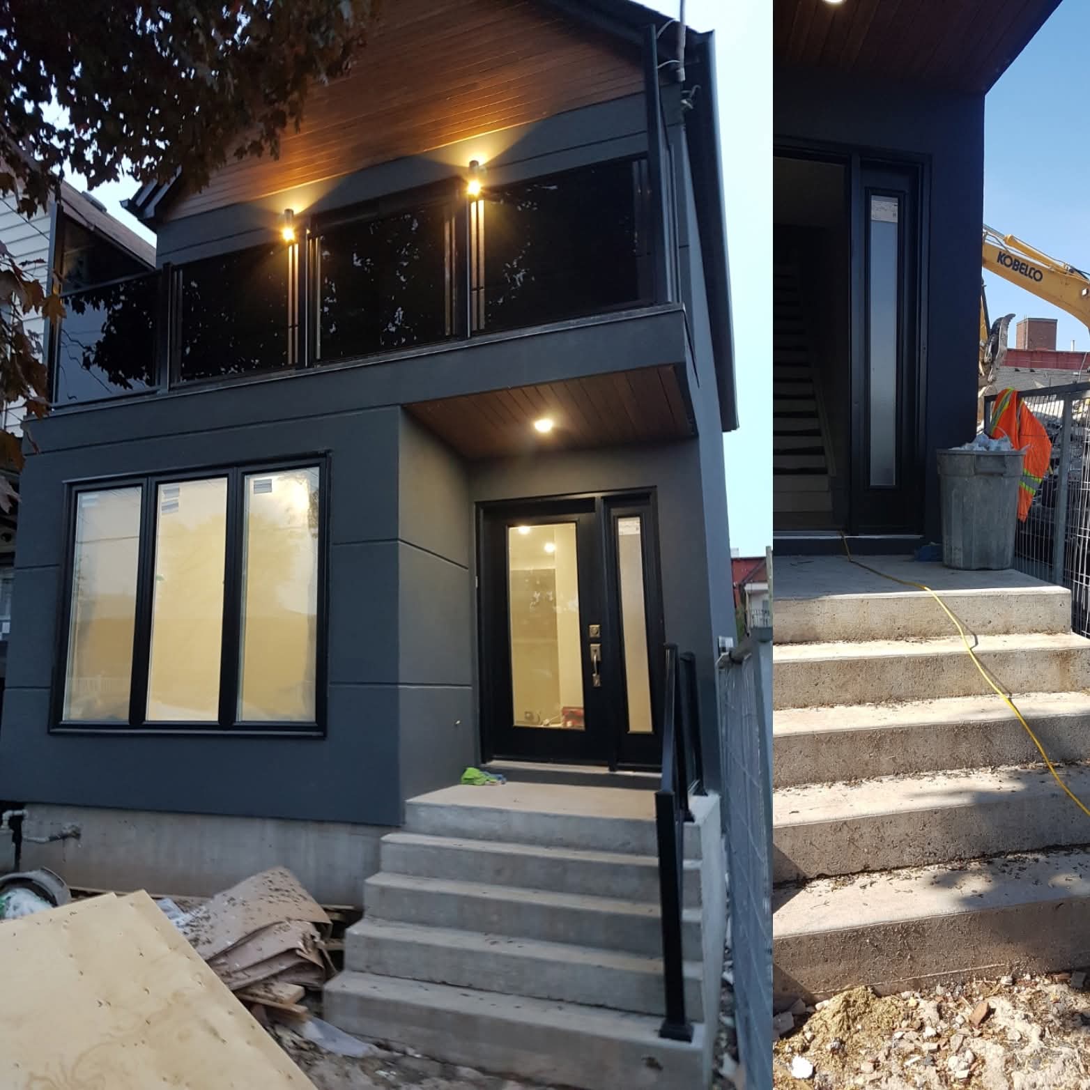 Modern charcoal house with black trim, glass balcony, and concrete front steps under construction.